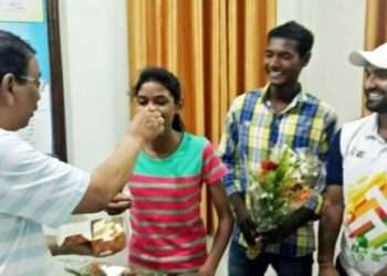 The then Gumla DC Shravan Sai giving sweets after selection in Bhopal academy