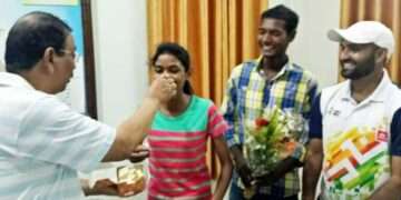 The then Gumla DC Shravan Sai giving sweets after selection in Bhopal academy