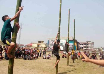 Nagaland Tribal Game | Participants at a greased pole climbing event